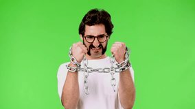 young crazy man with a rare beard with a chain. cutout against green chroma background