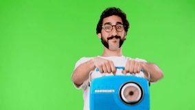 young crazy man with a rare beard and a vintage radio. cutout against green chroma background