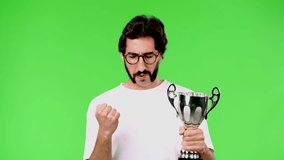 young crazy man with a rare beard and a trophy. cutout against green chroma background