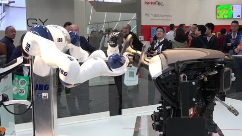 Hannover, Germany - April, 2018: IBG presenting robot and human collaboration on Messe fair in Hannover, Germany
