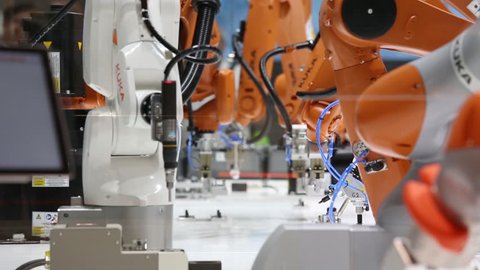 Hannover, Germany - April, 2018: Automation solutions of the future with robot arms on Kuka stand on Messe fair in Hannover, Germany