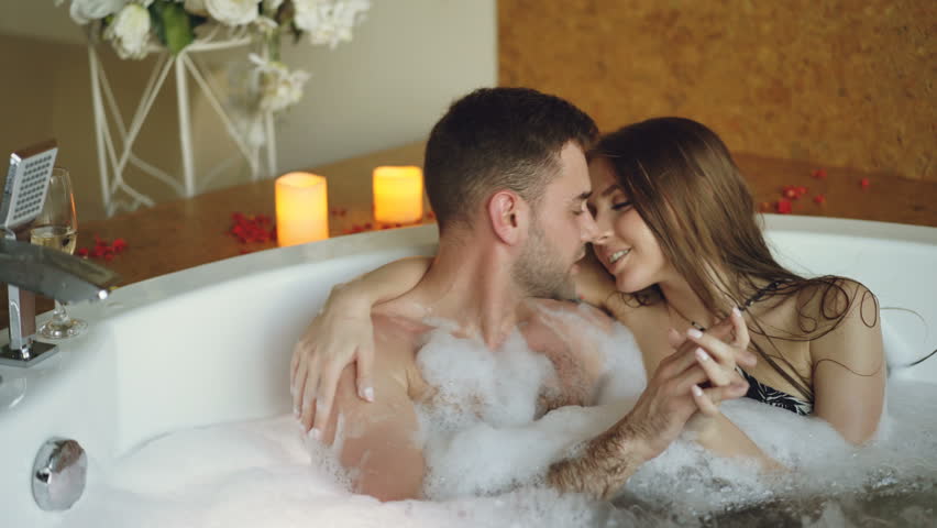 sensual young love in the hot tub
