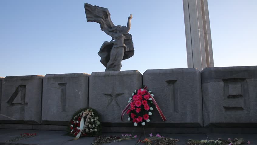 Victory Memorial to Soviet Army in Riga. Sunset, may. Man is walking