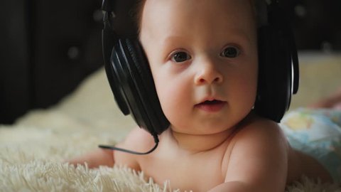 little baby with headphones