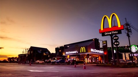 AYUTTHAYA - MAY 6 : McDonald's in Thailand at sunset, Corporation is the world's largest chain of hamburger fast food restaurants, during the day hours on May 6, 2018, Ayutthaya Thailand.