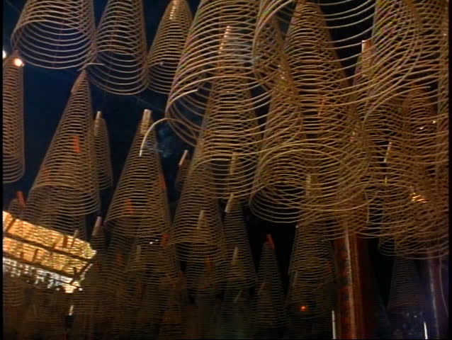 VIETNAM, 1999, Ho Chi Minh City, incense in long coils burning, smoky, top of temple