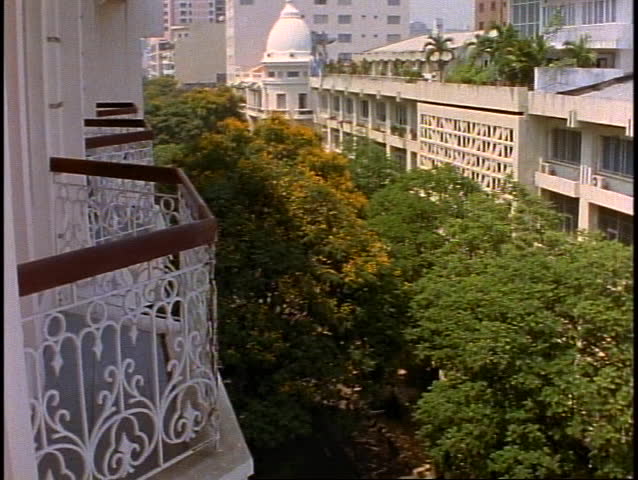 VIETNAM, 1999, Balcony view out over treetops of Ho Chi Minh City, Saigon, medium shot