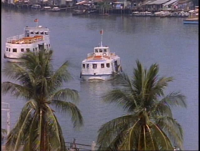 VIETNAM, 1999, Ho Chi Minh City, Saigon River, two ferries, medium close-up