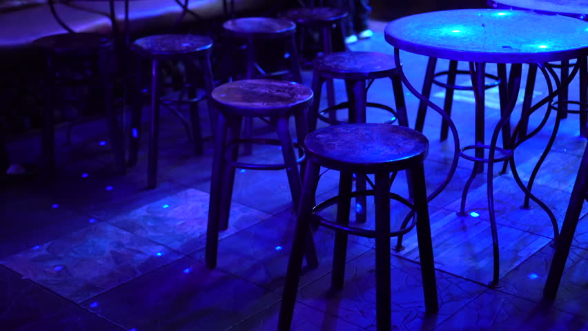Empty night club pub table under purple disco light Royalty-Free Stock Footage #1010757623