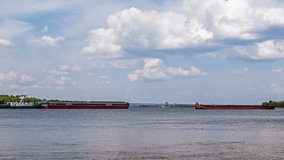 River traffic of cargo vessels. 4k Time Lapse. No flicker, no birds, retouched video.