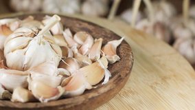Garlic spins in a wooden background