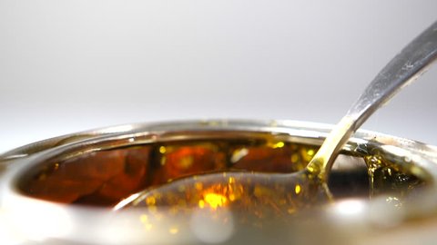 Golden Syrup Dripping Spoon Into Metal Stock Footage Video (100% ...