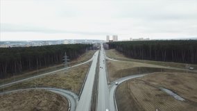 Highway road in forest landscape. Video. Aerial view of cars on highway at nature. Aerial landscape of highway road