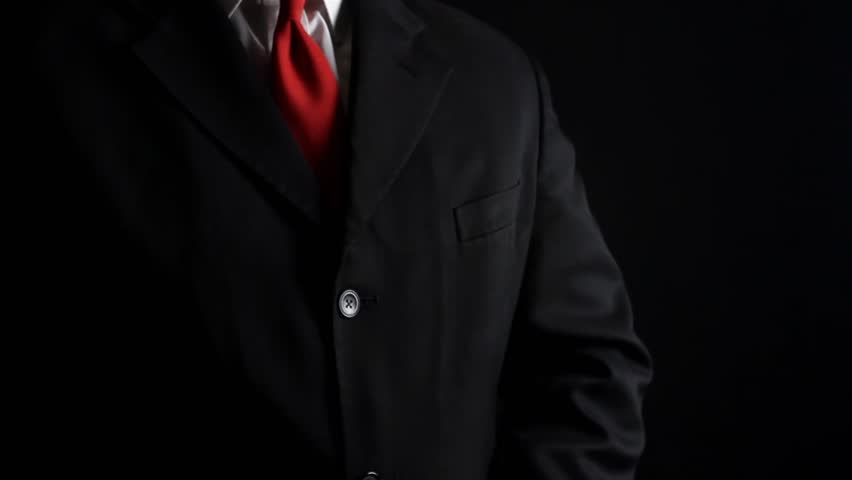 Photo of a rich businessman in black siut with red tie holding and counting money pack. Royalty-Free Stock Footage #1010777090