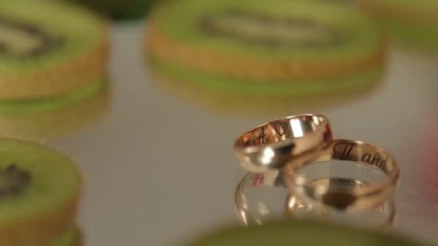 Wedding rings on a glass surface