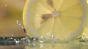 rolling lemon slices on dark background . Slow motion shot - Powered by Shutterstock - Get 15% off with code: PIKWIZARD15