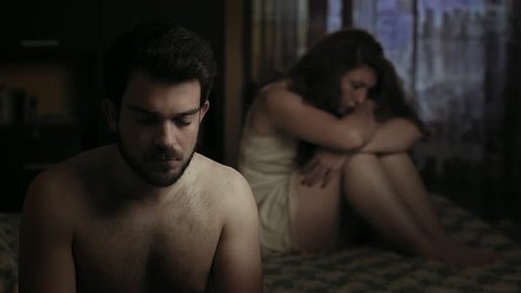 lovers having sexual problems: sad couple in bed