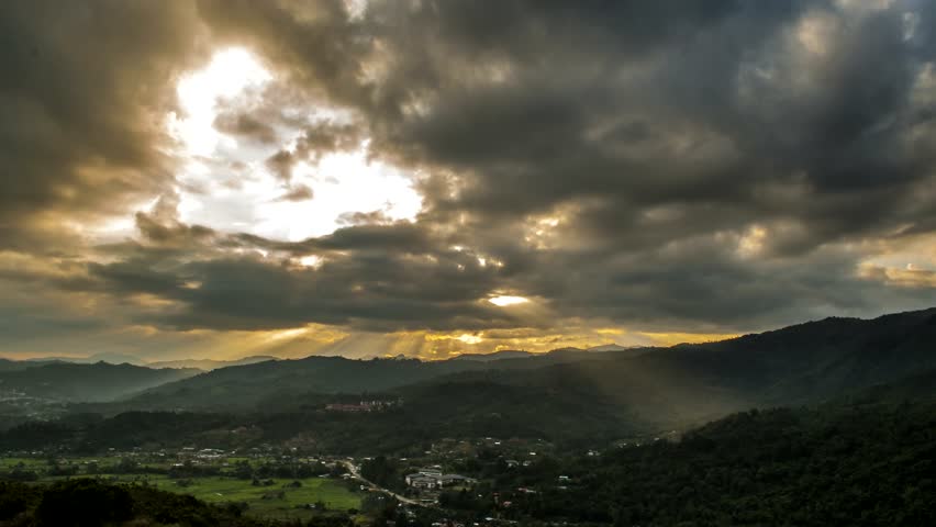 Sunset,moving cloud and ray of sunlight. Take at RANAU, SABAH, BORNEO, MALAYSIA. Timelapse zoom out