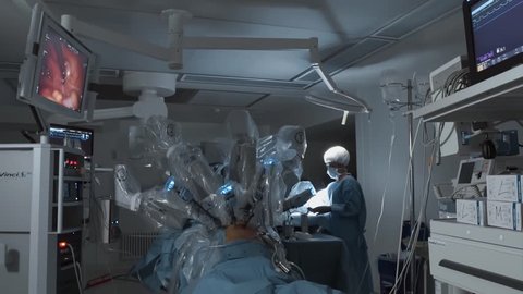 Operating room, futuristic medical surgical robot, cancerous tumor removal surgery. Modern medical equipment, robotic arms. Minimally Invasive Robotic Surgery. Modern medicine 