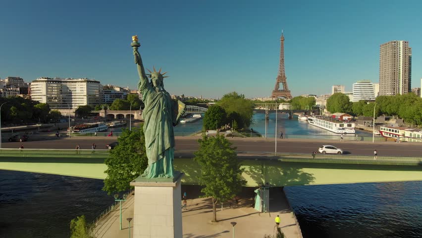 Smooth aerial Travelling close Shot of Lady Liberty, Seine river and Eiffel tower in Paris