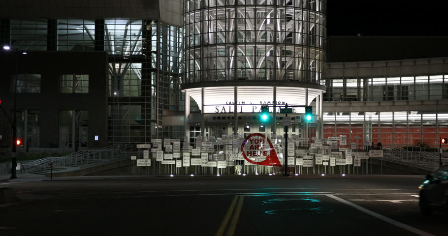 SALT LAKE CITY, UTAH - 27 MAR 2018: Salt Lake City Utah night traffic convention center. Night traffic transportation main street in Salt Lake City, Utah. Salt Palace convention center.