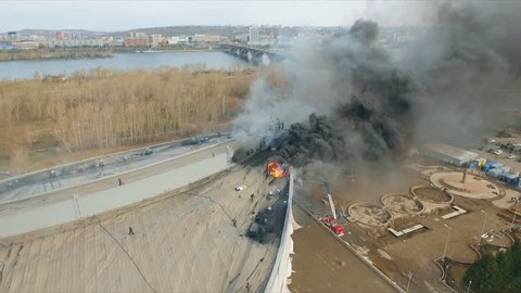 Krasnoyarsk, Russia - 08 may, 2018: Aerial view of the extinguishing a major fire on the roof of the stadium.