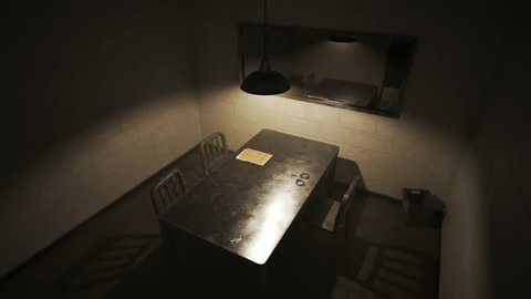 Empty, dark interrogation room with one-way mirror, metal table and chairs, handcuffs and case files.