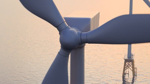 Offshore wind turbines at dusk. Close up camera.
