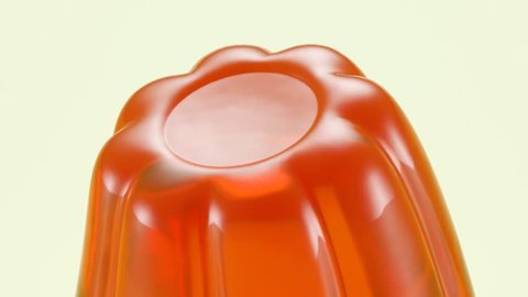 Wobbly single orange jelly isolated on white background.