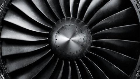 Closeup shot of spinning jet engine front fan. CFM56