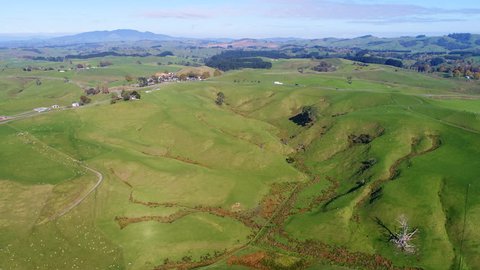 Aerial view of north island of New Zealand, picturesque lush green hills of Matamata region (Shire and Hobbiton - The Lord of the Rings and Hobbit location), sunset time, 4k UHD