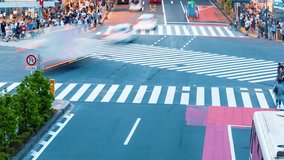 People cross the famous intersection in Shibuya, Tokyo, Japan one of the busiest crosswalks in the world.