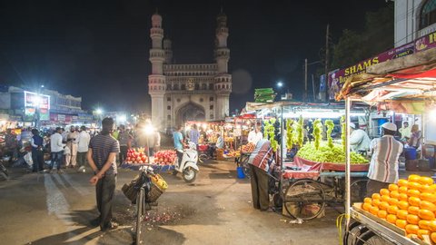 Jan 2018, India, Hyderabad, capital of Telangana State, (Andhra Pradesh), Street stalls and the Charminar (Four Minarets) monument - time lapse