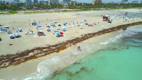 Aerial drone footage crowded summer Miami Beach Florida