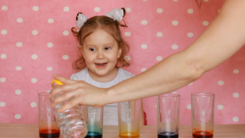 Experiments.Children's birthday. Tricks.Focuses.Chemistry.  Child and science experiment. Entertainment for children. preschool education. Multicolored drinks Royalty-Free Stock Footage #1010868761