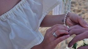 Footage wedding rings on hands. Full HD of Wedding couple just married at the beach, Bali. Wedding ceremony