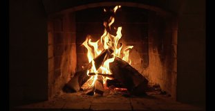 Burning Fire In The Fireplace. Slow motion. A looping clip of a fireplace with medium size flames