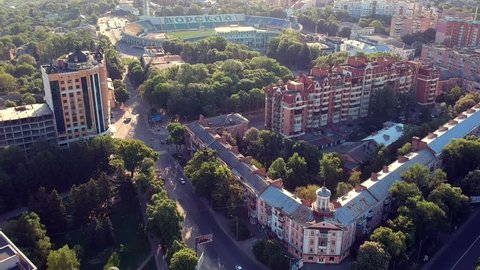 POLTAVA, UKRAINE - MAY 10, 2018: main Poltava city square with cars and trees in sunrise light.