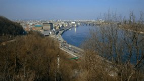 Elevated static shot of Podil district and river Dnieper with car traffic in Kiev, Ukraine