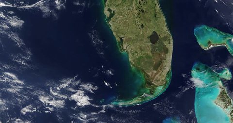 Very high-altitude overflight aerial of the Florida peninsula. Clip loops and is reversible. Elements of this image furnished by NASA
