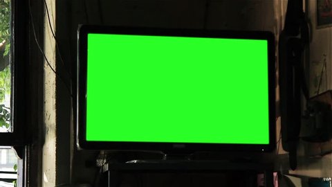 Television with Green Screen in an Argentine Restaurant. Zoom In Shot. You can Replace Green Screen with the Footage or Picture you Want with “Keying” effect in After Effects (check out tutorials).