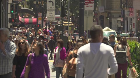 Busy street scene. Crowd of people walking in a shopping street - August 2017: San Francisco, California, US