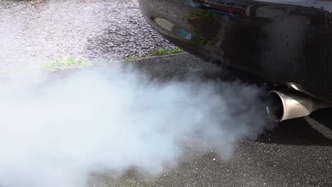 Close up of exhaust fumes from a car tail pipe