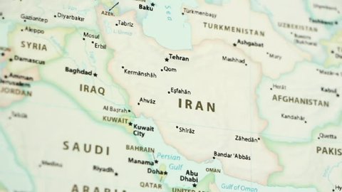 Iran on a political map of the world. Video defocuses showing and hiding the map.