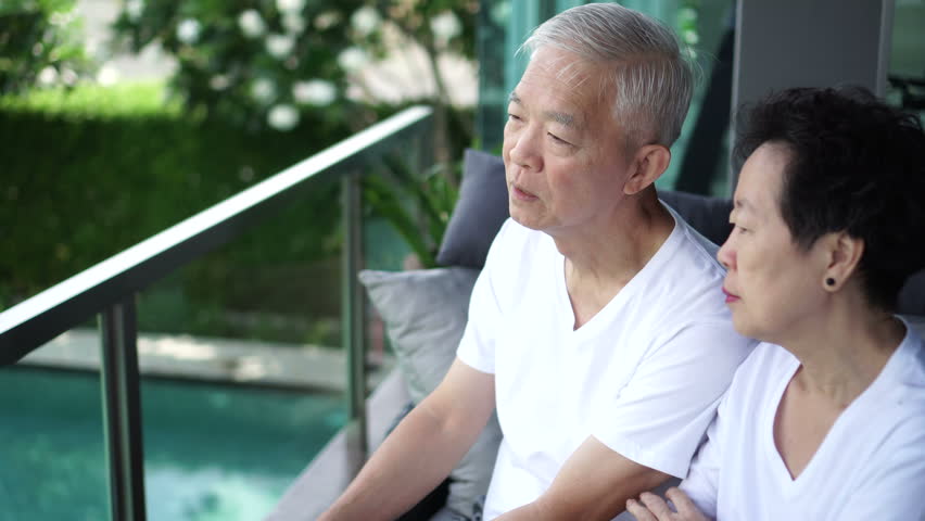Asian senior couple talk, discuss life problem together