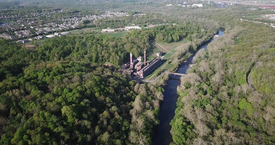 The waters of the Little Miami River trickle past the long-abandoned Peters Cartridge Company. 