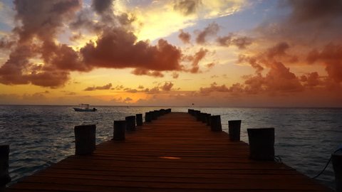 Caribbean sunrise in Mayan Riviera of Mexico beach pier

