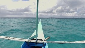 Point of view from Filipino fishing boat cruising on sea, taxi boat 
Turquoise blue clear water on coral reef sea. Shot in SLOW MOTION hd 1080p format video