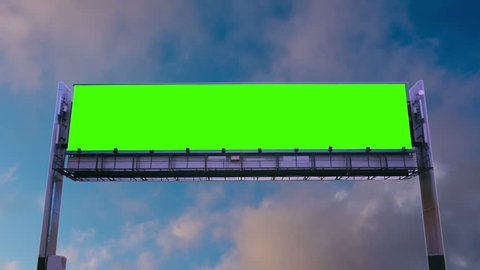 Billboard green screen on the background of flying clouds