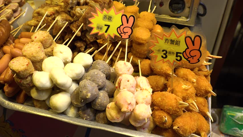 HONG KONG - CIRCA APRIL 2018 : Various STREET SNACK FOOD on stick at street food shop.